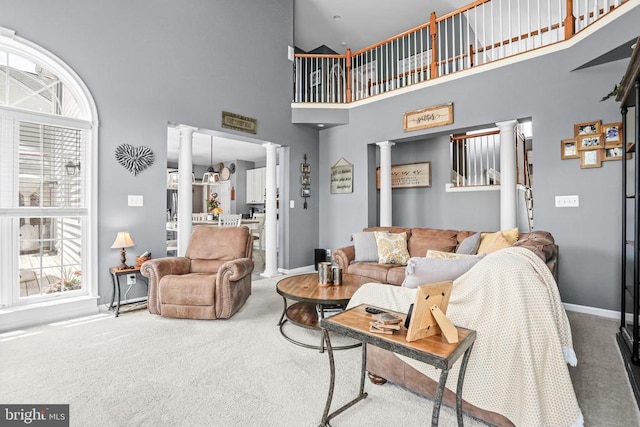 2609 Melissa Ct, Fredericksburg, VA 22408 - living area featuring decorative columns, carpet floors, baseboards, and a towering ceiling