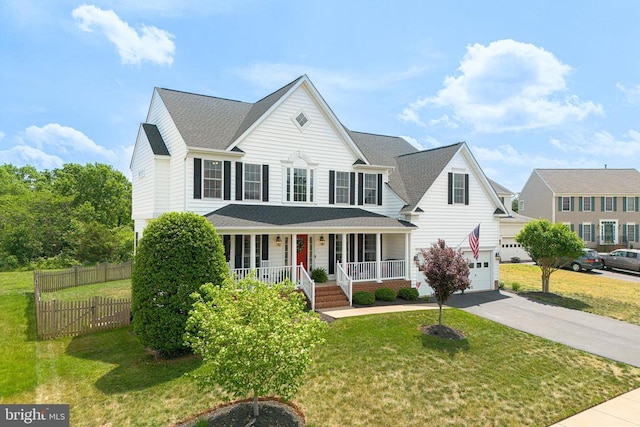 2609 Melissa Ct, Fredericksburg, VA 22408 - traditional-style house featuring a porch, an attached garage, driveway, and a shingled roof