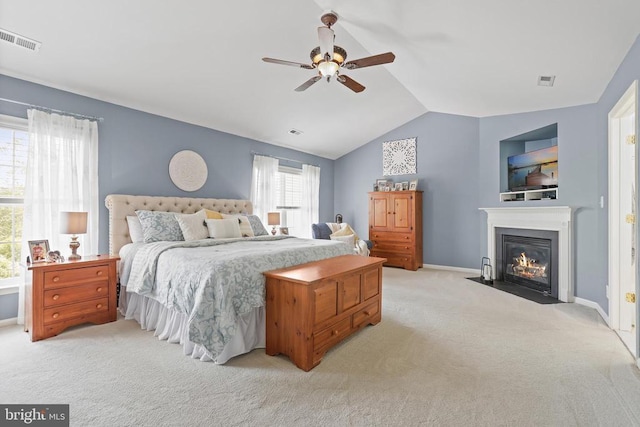 2609 Melissa Ct, Fredericksburg, VA 22408 - bedroom featuring light colored carpet, a fireplace with flush hearth, vaulted ceiling, a ceiling fan, and baseboards