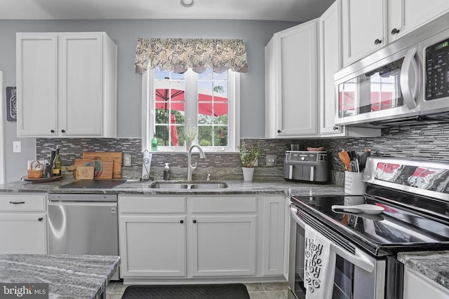 2609 Melissa Ct, Fredericksburg, VA 22408 - kitchen with appliances with stainless steel finishes, a sink, and white cabinets