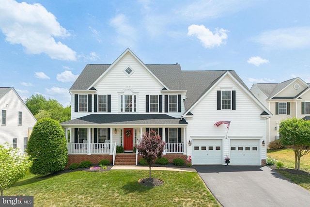 2609 Melissa Ct, Fredericksburg, VA 22408 - view of front of property with driveway, covered porch, a garage, a front yard, and roof with shingles