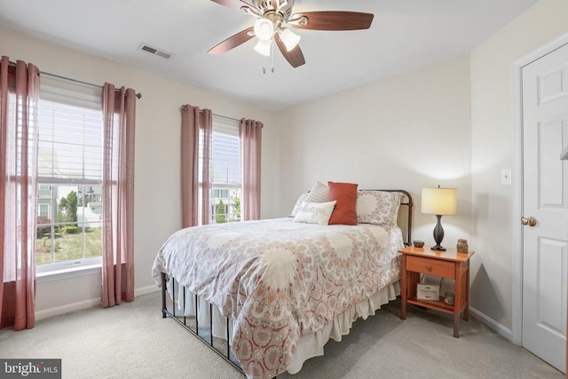 2609 Melissa Ct, Fredericksburg, VA 22408 - bedroom with baseboards, light colored carpet, multiple windows, and a ceiling fan