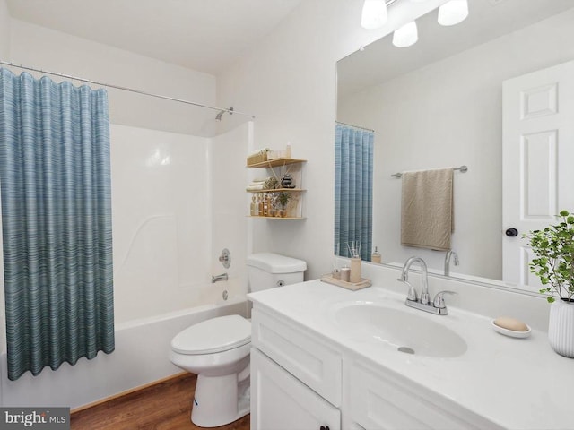 full bathroom with toilet, wood finished floors, shower / bathtub combination with curtain, and vanity