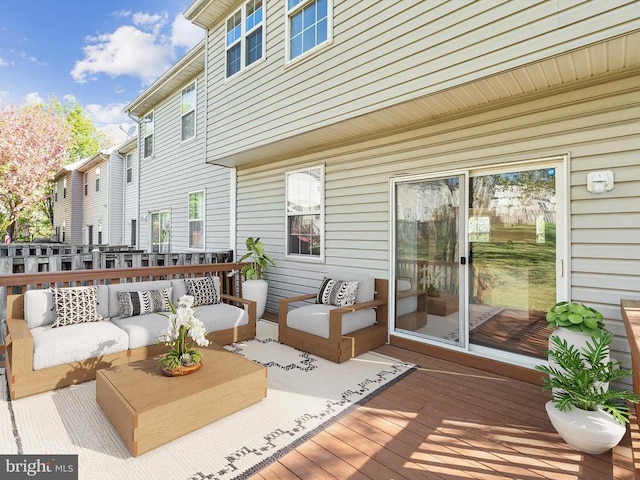 wooden deck with an outdoor hangout area