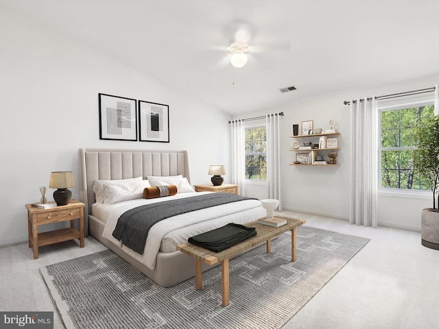 bedroom with carpet floors, vaulted ceiling, and ceiling fan