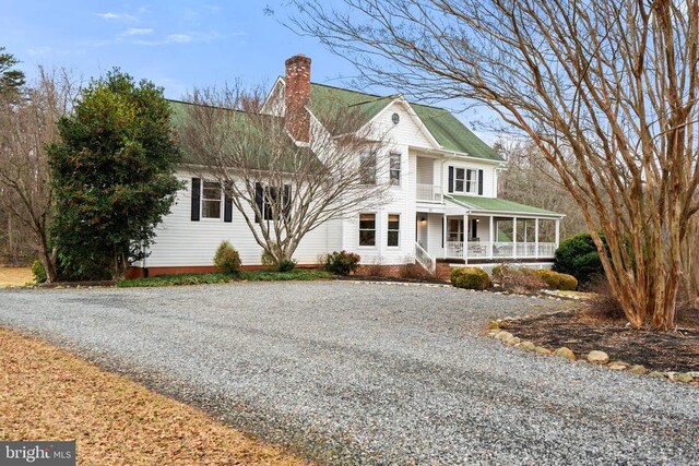 view of front of property with a front yard and covered porch