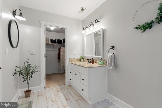 bathroom featuring vanity and hardwood / wood-style floors