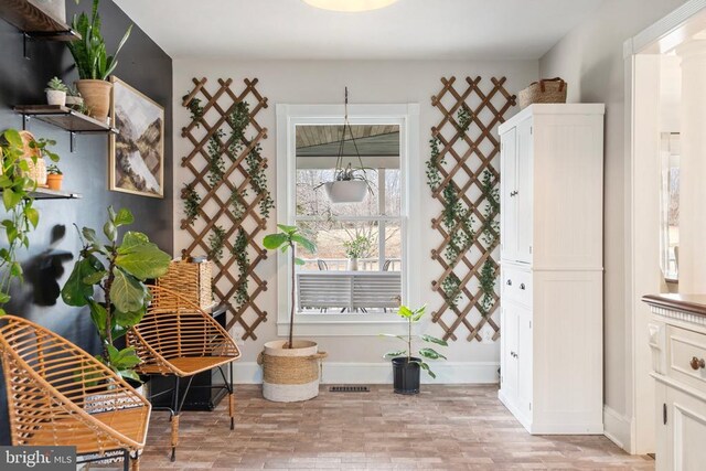 sitting room with light hardwood / wood-style flooring