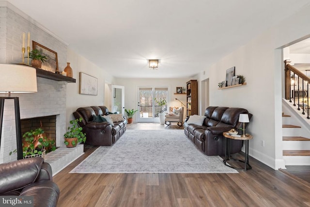 living room with a fireplace and dark hardwood / wood-style flooring