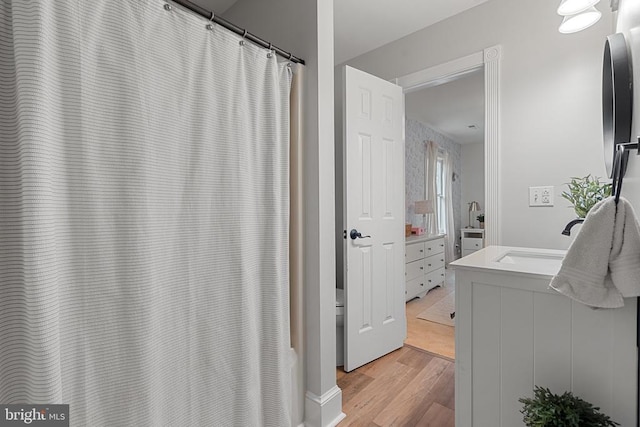 bathroom featuring vanity and hardwood / wood-style floors