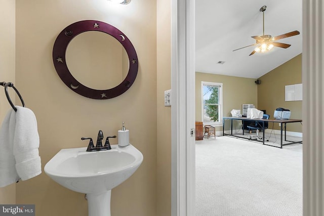 bathroom with lofted ceiling, sink, and ceiling fan