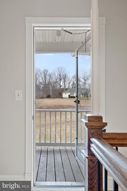 doorway with hardwood / wood-style flooring