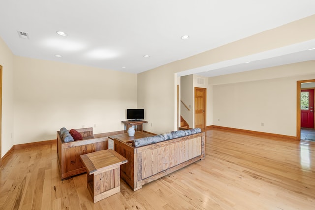 66 Spencer Ln, Lovingston, VA 22949 - living room featuring light wood-type flooring, stairway, visible vents, and baseboards
