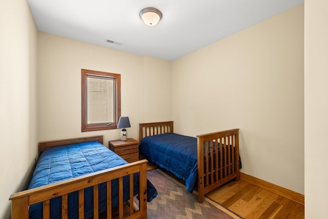 66 Spencer Ln, Lovingston, VA 22949 - bedroom with baseboards, visible vents, and wood finished floors