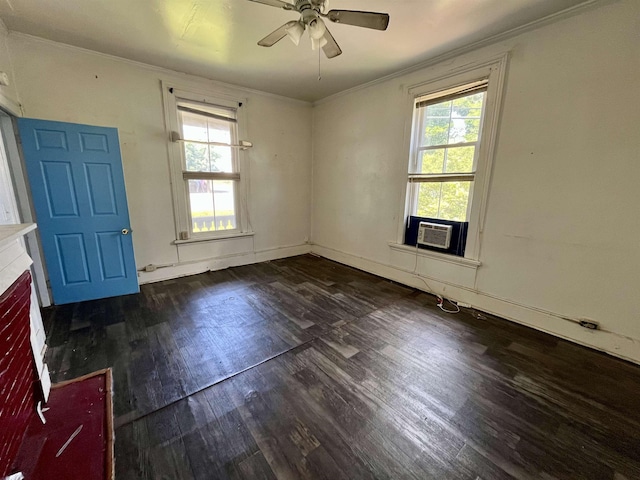 unfurnished room featuring ornamental molding, plenty of natural light, wood finished floors, ceiling fan, and cooling unit