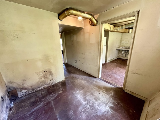 spare room with concrete floors
