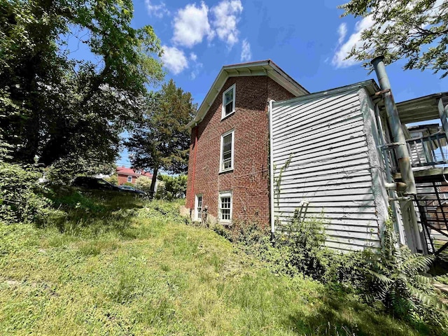 view of home's exterior with brick siding