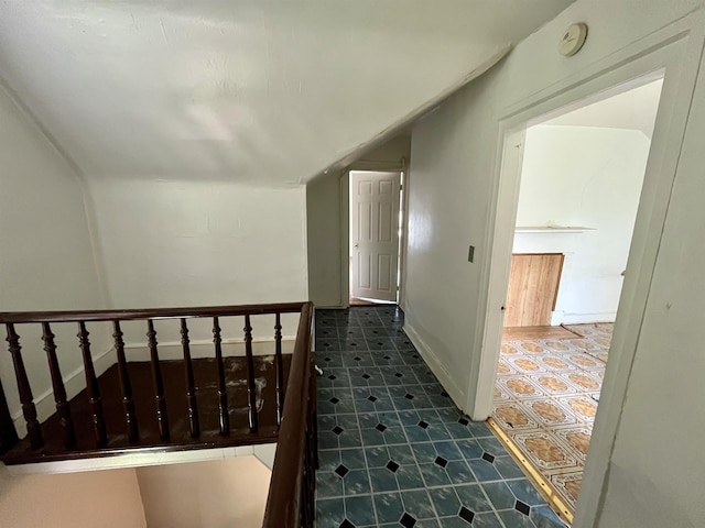 corridor featuring lofted ceiling
