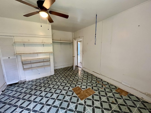 unfurnished bedroom featuring ceiling fan
