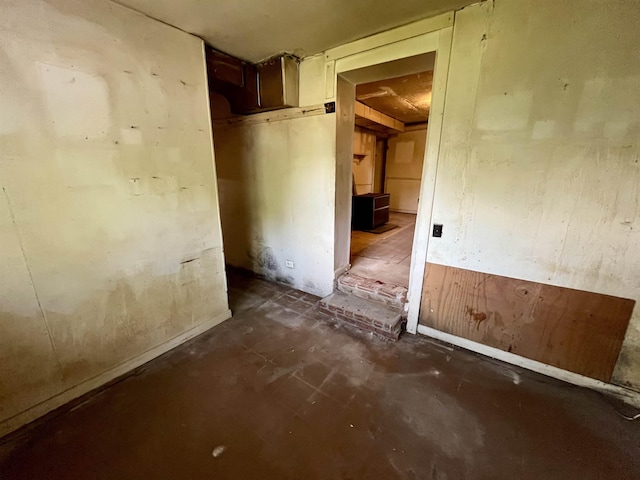 empty room featuring unfinished concrete flooring