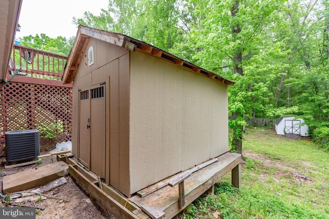 view of shed with central air condition unit