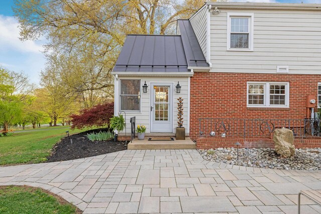 4111 Spotswood Trl, Penn Laird, VA 22846 - property entrance featuring a standing seam roof, brick siding, metal roof, and a lawn
