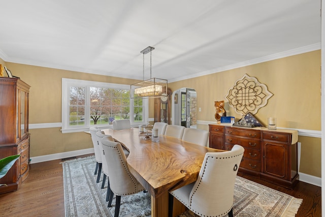 4111 Spotswood Trl, Penn Laird, VA 22846 - dining room with arched walkways, baseboards, dark wood-style flooring, crown molding, and a chandelier