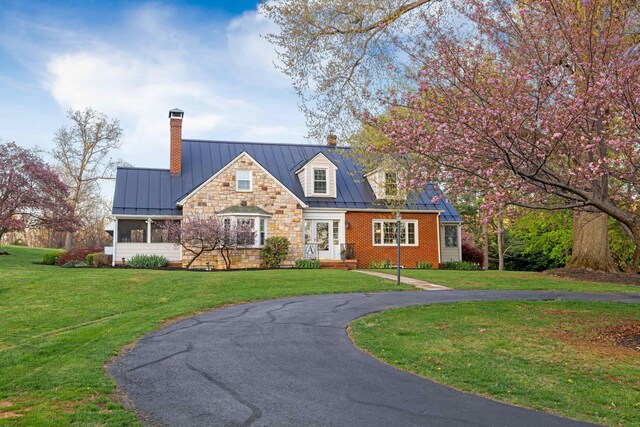 4111 Spotswood Trl, Penn Laird, VA 22846 - cape cod-style house with a standing seam roof, a chimney, a front yard, curved driveway, and metal roof