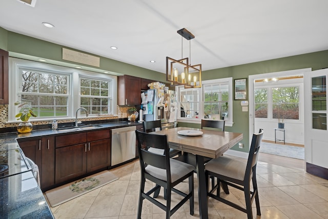 4111 Spotswood Trl, Penn Laird, VA 22846 - kitchen with appliances with stainless steel finishes, a sink, dark countertops, light tile patterned floors, and tasteful backsplash