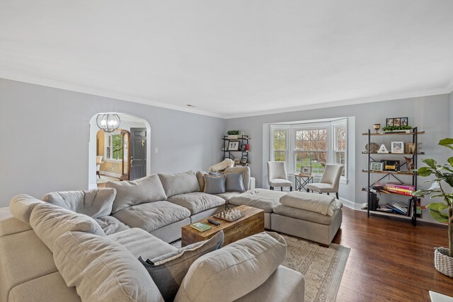 4111 Spotswood Trl, Penn Laird, VA 22846 - living room featuring arched walkways, dark wood-style floors, crown molding, and baseboards