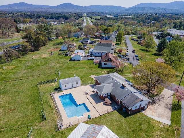 bird's eye view of a mountain backdrop and a pool