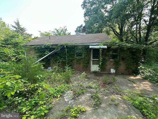 10017 Hayden Rd, Spotsylvania, VA 22551 - back of house with brick siding and a chimney