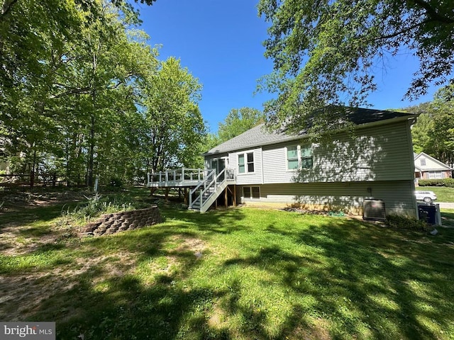 11934 Gardenia Dr, Fredericksburg, VA 22407 - rear view of house featuring central air condition unit, a wooden deck, stairway, and a lawn