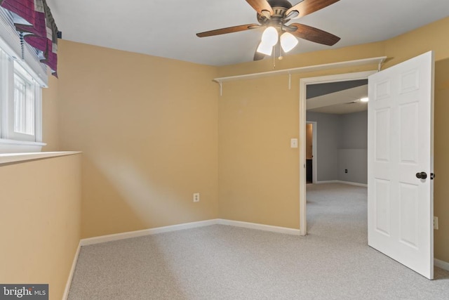 11934 Gardenia Dr, Fredericksburg, VA 22407 - spare room with a ceiling fan, light carpet, and baseboards