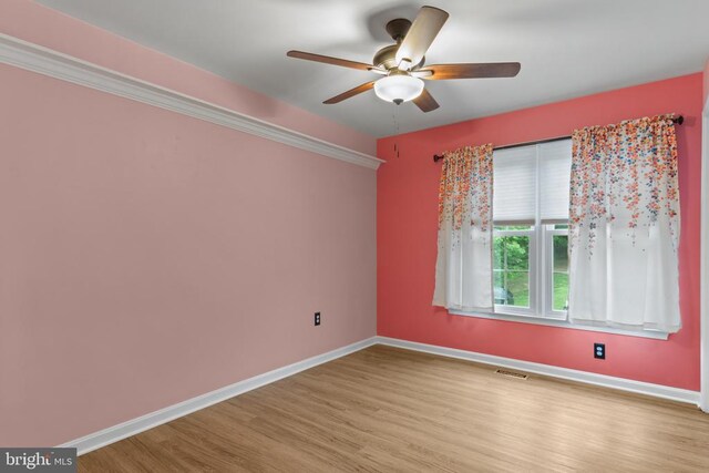 11934 Gardenia Dr, Fredericksburg, VA 22407 - spare room featuring wood finished floors, ceiling fan, and baseboards