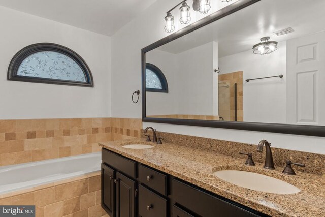 11934 Gardenia Dr, Fredericksburg, VA 22407 - bathroom with a bath, double vanity, and tiled shower