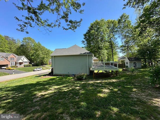 11934 Gardenia Dr, Fredericksburg, VA 22407 - view of side of home with a wooden deck and a lawn
