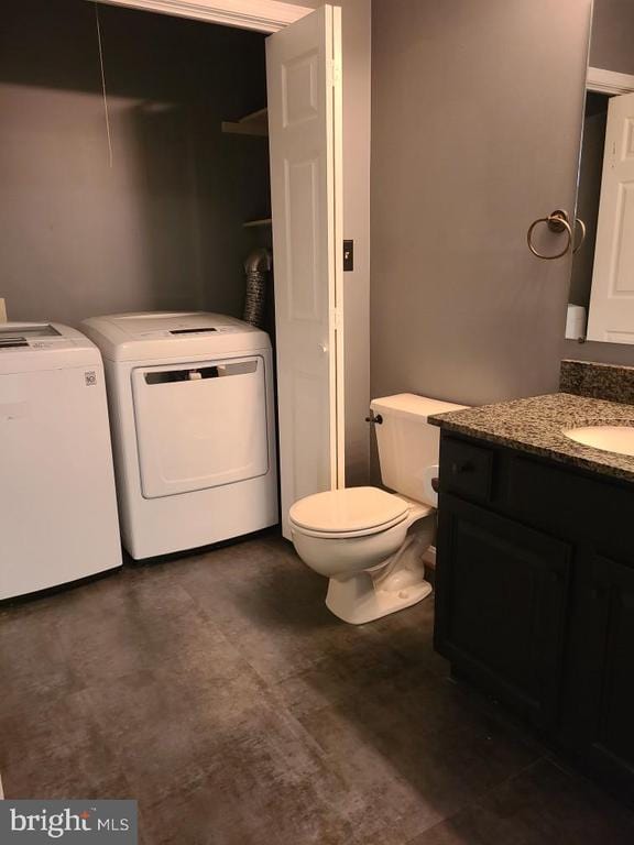 11934 Gardenia Dr, Fredericksburg, VA 22407 - bathroom with separate washer and dryer, vanity, and toilet