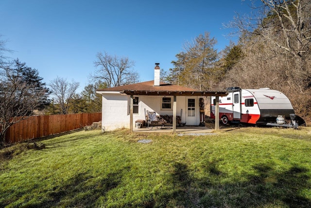 2077 Deerfield Valley Rd, West Augusta, VA 24485 - back of property with a chimney, a yard, a patio, and fence