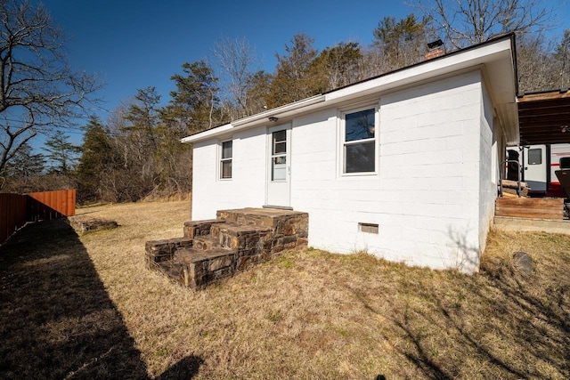 2077 Deerfield Valley Rd, West Augusta, VA 24485 - rear view of house with fence, a lawn, and concrete block siding