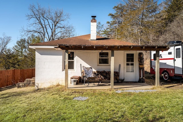 2077 Deerfield Valley Rd, West Augusta, VA 24485 - rear view of property featuring a chimney, fence, and a lawn