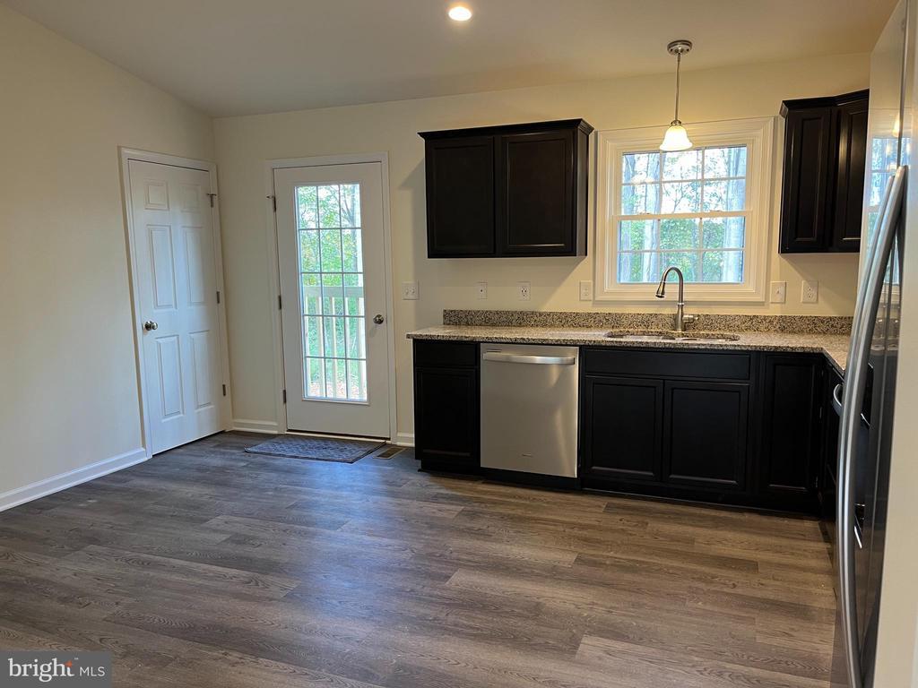 1219 Arrington Mountain Rd, Haywood, VA 22722 - kitchen featuring stainless steel appliances, plenty of natural light, light stone counters, dark wood-style flooring, and recessed lighting