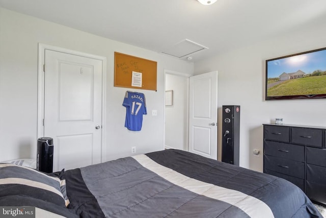 bedroom with attic access