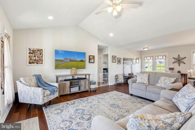 living room featuring ceiling fan, lofted ceiling, baseboards, wood finished floors, and recessed lighting