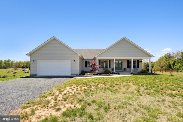 single story home featuring a garage, driveway, and a porch