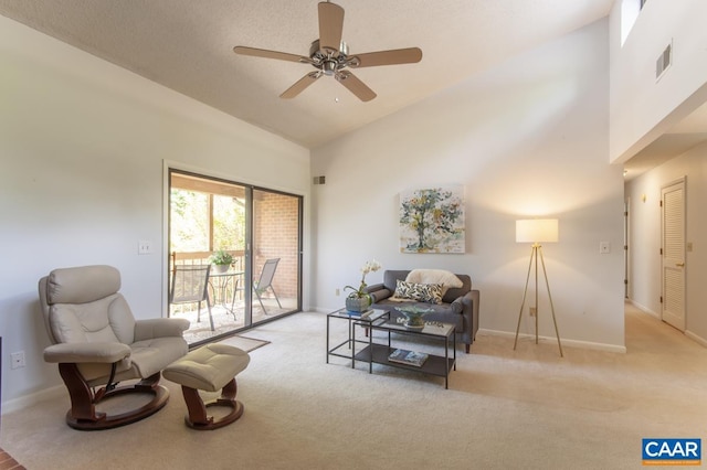 117 Turtle Creek Rd Unit 9, Charlottesville, VA 22901 - living room with ceiling fan, high vaulted ceiling, light colored carpet, and baseboards