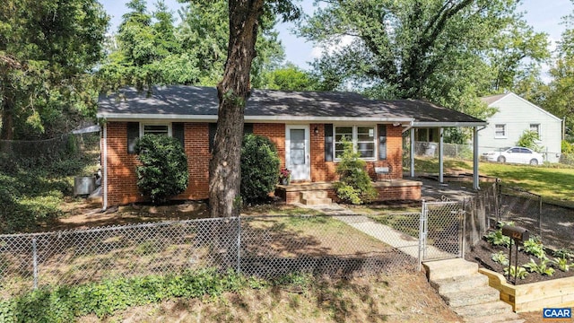 122 Westerly Ave, Charlottesville, VA 22903 - ranch-style home featuring a gate, a fenced front yard, brick siding, and a carport
