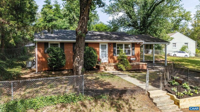 122 Westerly Ave, Charlottesville, VA 22903 - ranch-style home featuring a gate, a fenced front yard, brick siding, and a carport