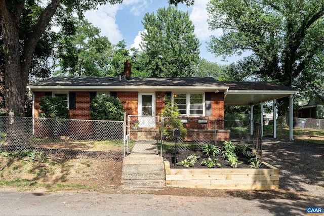 122 Westerly Ave, Charlottesville, VA 22903 - view of front of house with brick siding, an attached carport, a chimney, and a gate