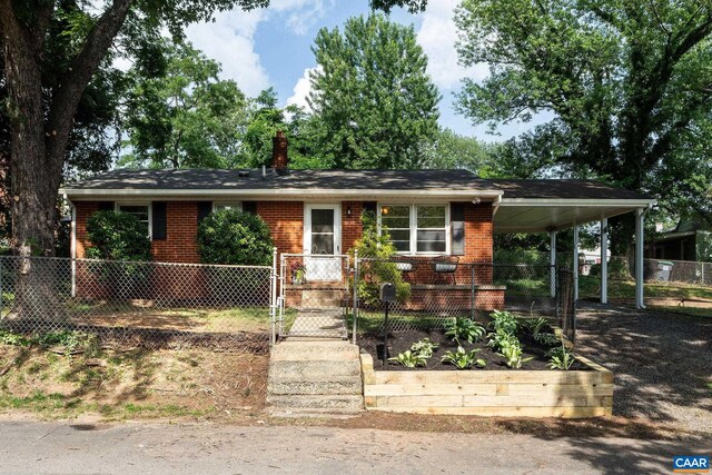 122 Westerly Ave, Charlottesville, VA 22903 - view of front of house with brick siding, an attached carport, a chimney, and a gate